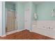 Bathroom featuring a soaking tub, walk-in shower, and wood-look floors at 615 Brookwater Dr, Stockbridge, GA 30281
