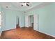 Bedroom highlighting tray ceilings, wood-look floors and natural light at 615 Brookwater Dr, Stockbridge, GA 30281