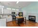 Kitchen featuring white cabinets, stainless steel appliances, a center island and a fireplace at 615 Brookwater Dr, Stockbridge, GA 30281