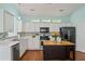 Kitchen featuring white cabinets, stainless steel appliances, and a center island at 615 Brookwater Dr, Stockbridge, GA 30281
