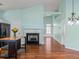 Open floorplan displaying wood floors, a fireplace and a center island at 615 Brookwater Dr, Stockbridge, GA 30281