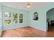 Bright living room with hardwood floors, large windows, and backyard views at 615 Brookwater Dr, Stockbridge, GA 30281