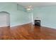 Large living room featuring hardwood floors and a cozy fireplace at 615 Brookwater Dr, Stockbridge, GA 30281