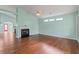 Living room with hardwood floors, vaulted ceiling, and fireplace at 615 Brookwater Dr, Stockbridge, GA 30281