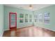 Sunroom with wood flooring and backyard views, plus an exterior door at 615 Brookwater Dr, Stockbridge, GA 30281