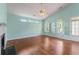 Bright living room with hardwood floors, fireplace, and natural light at 615 Brookwater Dr, Stockbridge, GA 30281