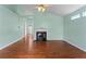 Spacious living room showcasing hardwood floors and a cozy fireplace at 615 Brookwater Dr, Stockbridge, GA 30281