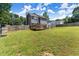 Expansive backyard featuring lush green grass and a fenced perimeter at 625 Hickory Nobb, Sugar Hill, GA 30518