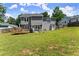 Well-maintained backyard with spacious green lawn and a deck at 625 Hickory Nobb, Sugar Hill, GA 30518