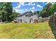 Large backyard featuring a deck and privacy fence at 625 Hickory Nobb, Sugar Hill, GA 30518