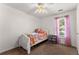 A cozy bedroom featuring a single bed, bright window, and simple decor at 625 Hickory Nobb, Sugar Hill, GA 30518