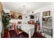 Formal dining room featuring hardwood floors, chandelier, and decorative wall tapestry at 625 Hickory Nobb, Sugar Hill, GA 30518