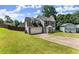 Two-story home featuring a two-car garage and well-kept front lawn at 625 Hickory Nobb, Sugar Hill, GA 30518