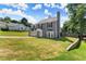 Two-story home featuring a two-car garage and well-kept front lawn at 625 Hickory Nobb, Sugar Hill, GA 30518