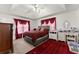 Main bedroom with tray ceiling, large bed, dark wood dresser, and a plush area rug at 625 Hickory Nobb, Sugar Hill, GA 30518
