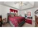 The main bedroom features tray ceiling, large bed, dresser, area rug and an open walkway at 625 Hickory Nobb, Sugar Hill, GA 30518