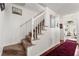 Staircase with carpet steps and white railing at 625 Hickory Nobb, Sugar Hill, GA 30518