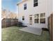 Backyard with a concrete patio, privacy fence, and grassy area at 2453 Honey Way, Conyers, GA 30013