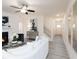 Open-concept living room with a fireplace, staircase, and plenty of natural light at 2453 Honey Way, Conyers, GA 30013