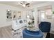 Bright living room with a modern sofa, decorative pillows, fireplace, and view into the dining area at 2453 Honey Way, Conyers, GA 30013