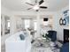 Open-concept living room showcasing the fireplace, dining area, and modern decor at 2453 Honey Way, Conyers, GA 30013
