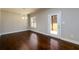 Dining room features hardwood floors, crown moulding, and access to the backyard through a glass door at 2571 Se Ebenezer Rd, Conyers, GA 30094