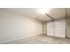 Clean and spacious garage featuring a white door and ample storage at 2571 Se Ebenezer Rd, Conyers, GA 30094