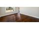 Living room with hardwood floors, bright windows, and white trim at 2571 Se Ebenezer Rd, Conyers, GA 30094