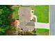 Aerial view of the home with a deck, patio, and a spacious driveway at 5826 Andover Way, Tucker, GA 30084