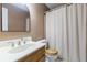 Cozy bathroom featuring a toilet, sink, and shower with a curtain, offering essential amenities at 5826 Andover Way, Tucker, GA 30084