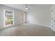 Bedroom with two windows, neutral walls, and a ceiling fan, creating a calm and comfortable atmosphere at 5826 Andover Way, Tucker, GA 30084
