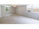 Spacious bedroom with neutral walls and carpet and natural light from two windows at 5826 Andover Way, Tucker, GA 30084