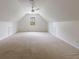 Spacious bonus room with neutral carpeting, a window, and a ceiling fan at 5826 Andover Way, Tucker, GA 30084