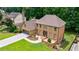 Beautiful brick home featuring a well-manicured lawn and an attached garage at 5826 Andover Way, Tucker, GA 30084