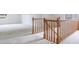Carpeted hallway featuring a wooden railing at 5826 Andover Way, Tucker, GA 30084