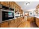 Spacious kitchen featuring stainless steel appliances and views into the living spaces at 5826 Andover Way, Tucker, GA 30084