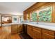 Kitchen featuring light countertops, wooden cabinets, and hardwood flooring at 5826 Andover Way, Tucker, GA 30084