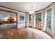 Cozy living room with a brick fireplace, wood trim, and access to the deck at 5826 Andover Way, Tucker, GA 30084