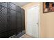 Basement storage area with black partition and white door at 7030 Kingston Ln, Mcdonough, GA 30253