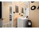 Well-lit bathroom with a vanity, modern mirror, decorative accents, and a cozy, inviting atmosphere at 7030 Kingston Ln, Mcdonough, GA 30253