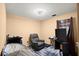 Cozy bedroom featuring neutral walls, a ceiling fan, and a comfortable recliner for relaxing at 7030 Kingston Ln, Mcdonough, GA 30253