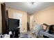 Bedroom with neutral walls, contrasting baseboards, ceiling fan and space for comfortable living at 7030 Kingston Ln, Mcdonough, GA 30253