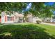 Lovely one-story home with red shutters, a manicured lawn, and mature shade trees at 7030 Kingston Ln, Mcdonough, GA 30253