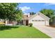 Inviting one-story home with a cozy front porch and lush green lawn at 7030 Kingston Ln, Mcdonough, GA 30253