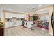 Spacious kitchen with white cabinets, modern appliances, and an adjacent dining area at 7030 Kingston Ln, Mcdonough, GA 30253