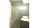 Bathroom featuring a tub/shower combo with white subway tile and a modern vanity at 763 N Hairston Rd, Stone Mountain, GA 30083