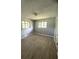 Bright bedroom featuring modern gray walls, and wood-look vinyl flooring at 763 N Hairston Rd, Stone Mountain, GA 30083