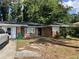 Charming single-story brick home featuring a well-maintained front yard and classic architectural details at 763 N Hairston Rd, Stone Mountain, GA 30083