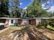 Charming single-story brick home featuring a well-maintained front yard and classic architectural details at 763 N Hairston Rd, Stone Mountain, GA 30083