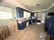 Kitchen featuring wood look flooring, stainless steel appliances, and dark blue cabinets at 763 N Hairston Rd, Stone Mountain, GA 30083